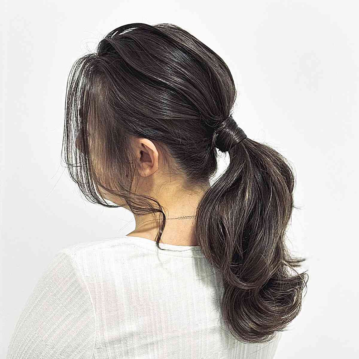 Prom-Perfect Low Pony with Face-Framing Pieces for Medium Haircut
