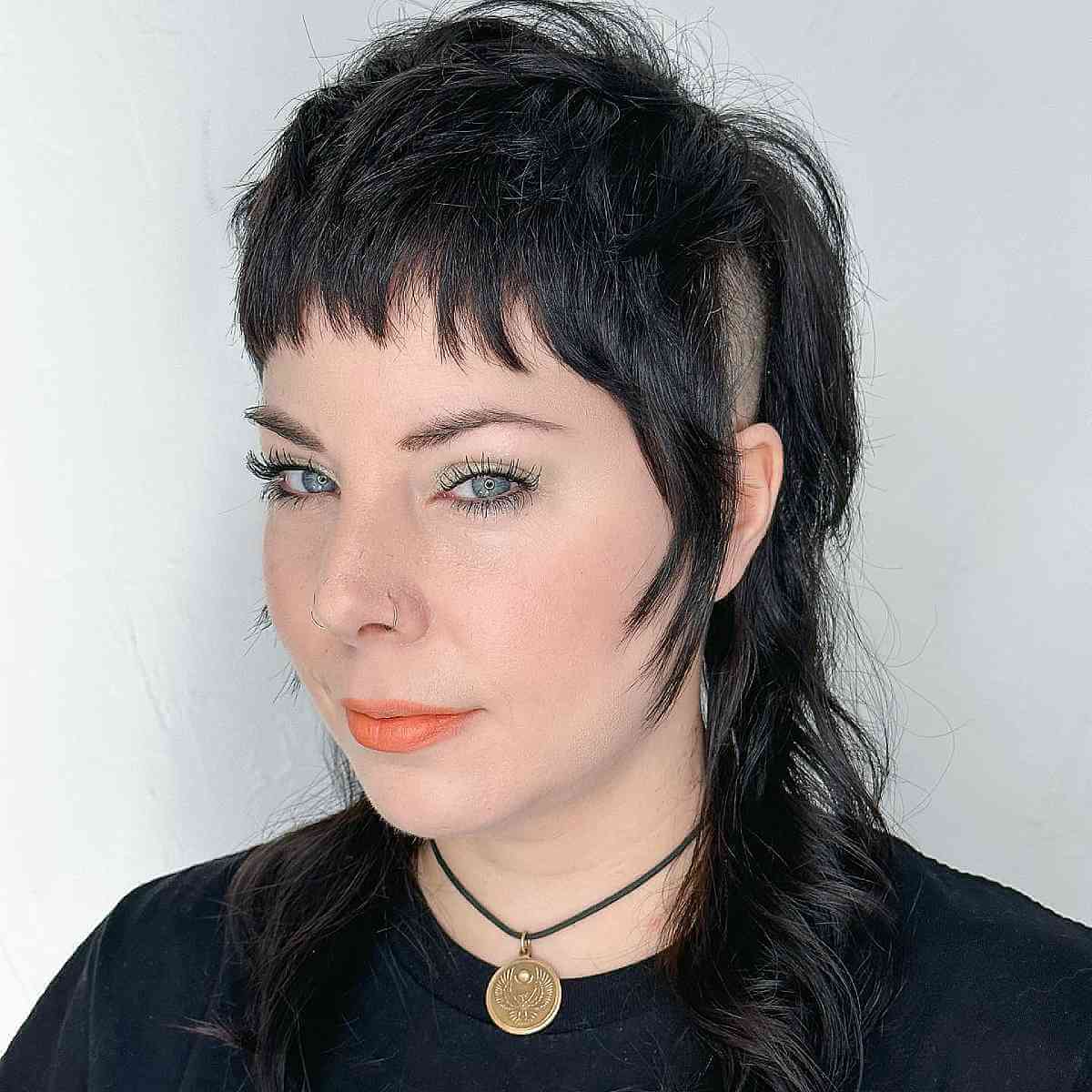 Punk Rock-Inspired Shag Mullet with a Shaved Side 