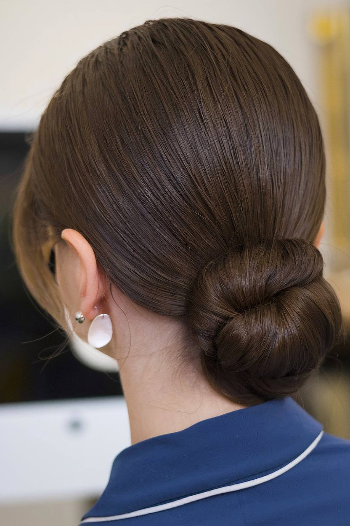 Quick easy hairstyle for long hair for work with a sleek low bun