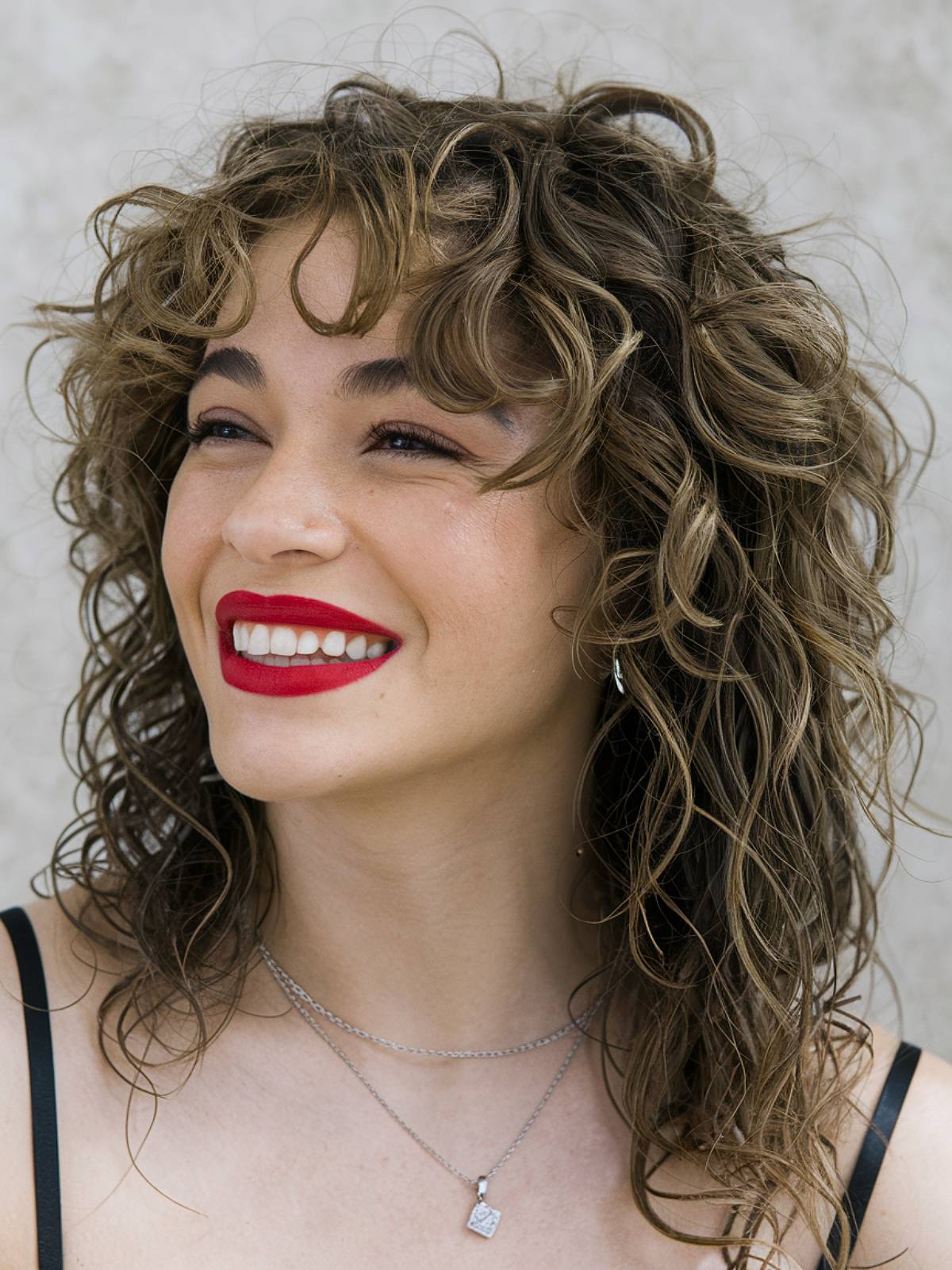 Soft curly shag haircut with layered bouncy curls