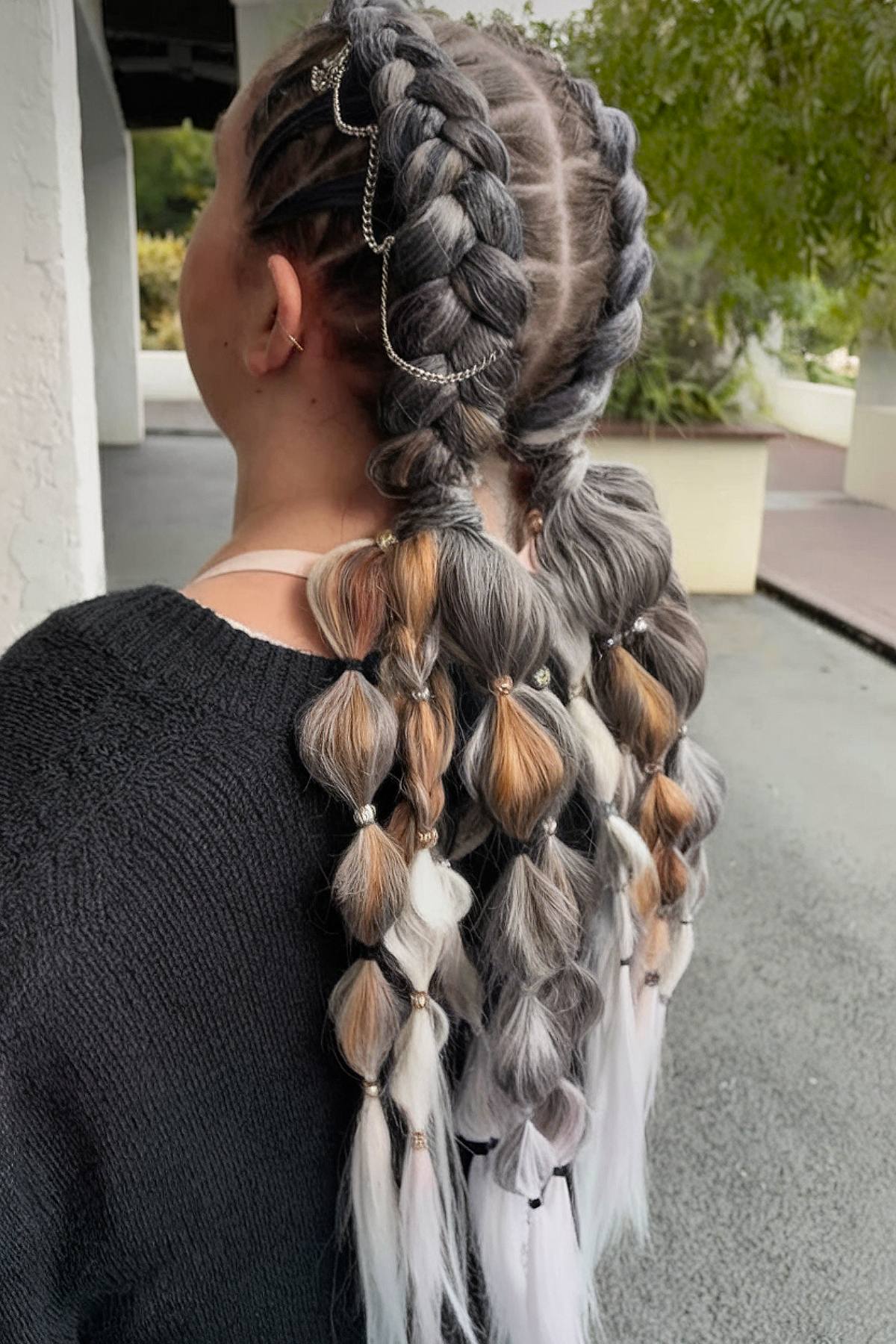 Braided bubble hairstyle with jewelry accents for raves