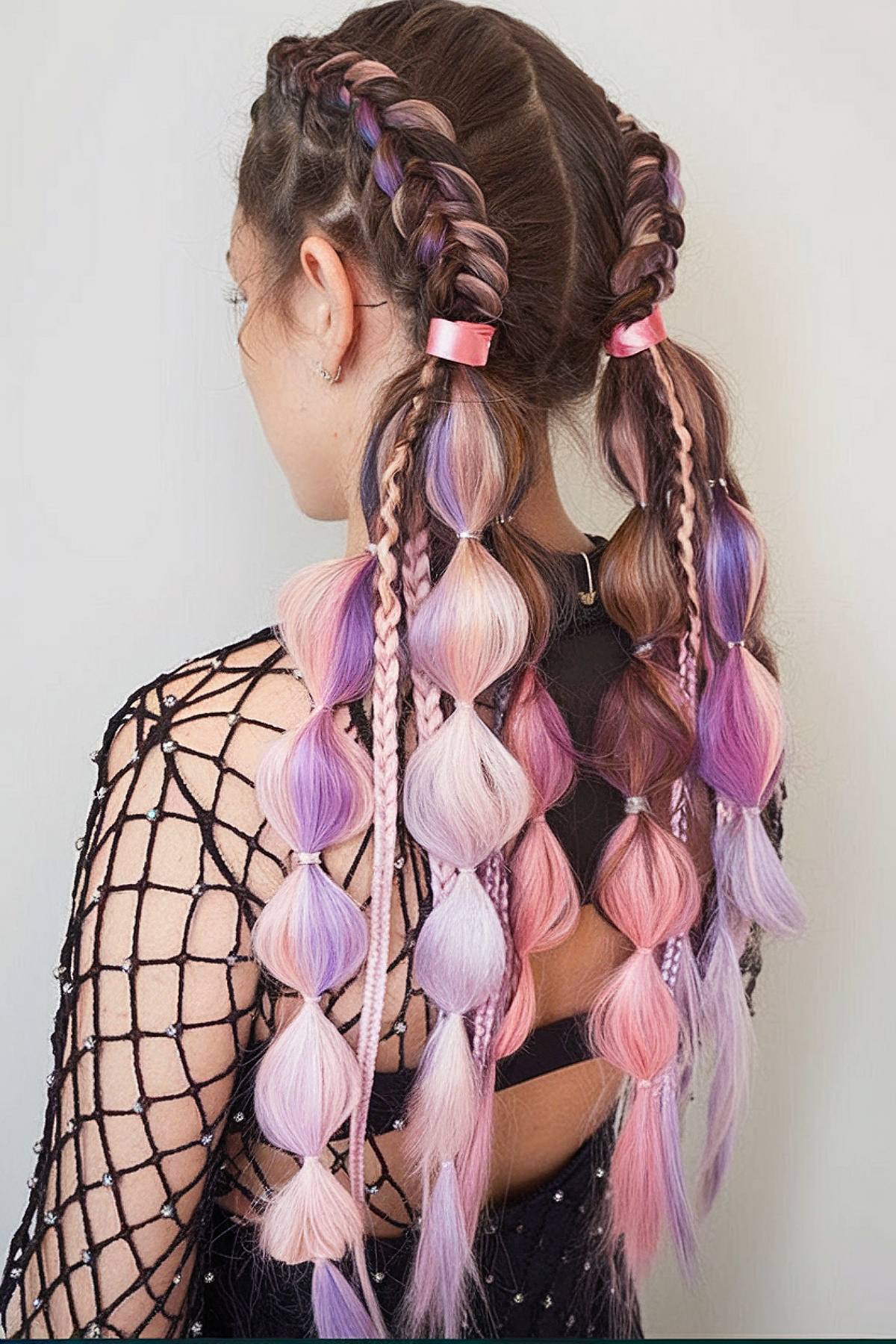 Pink and purple bubble braids for a fun rave hairstyle