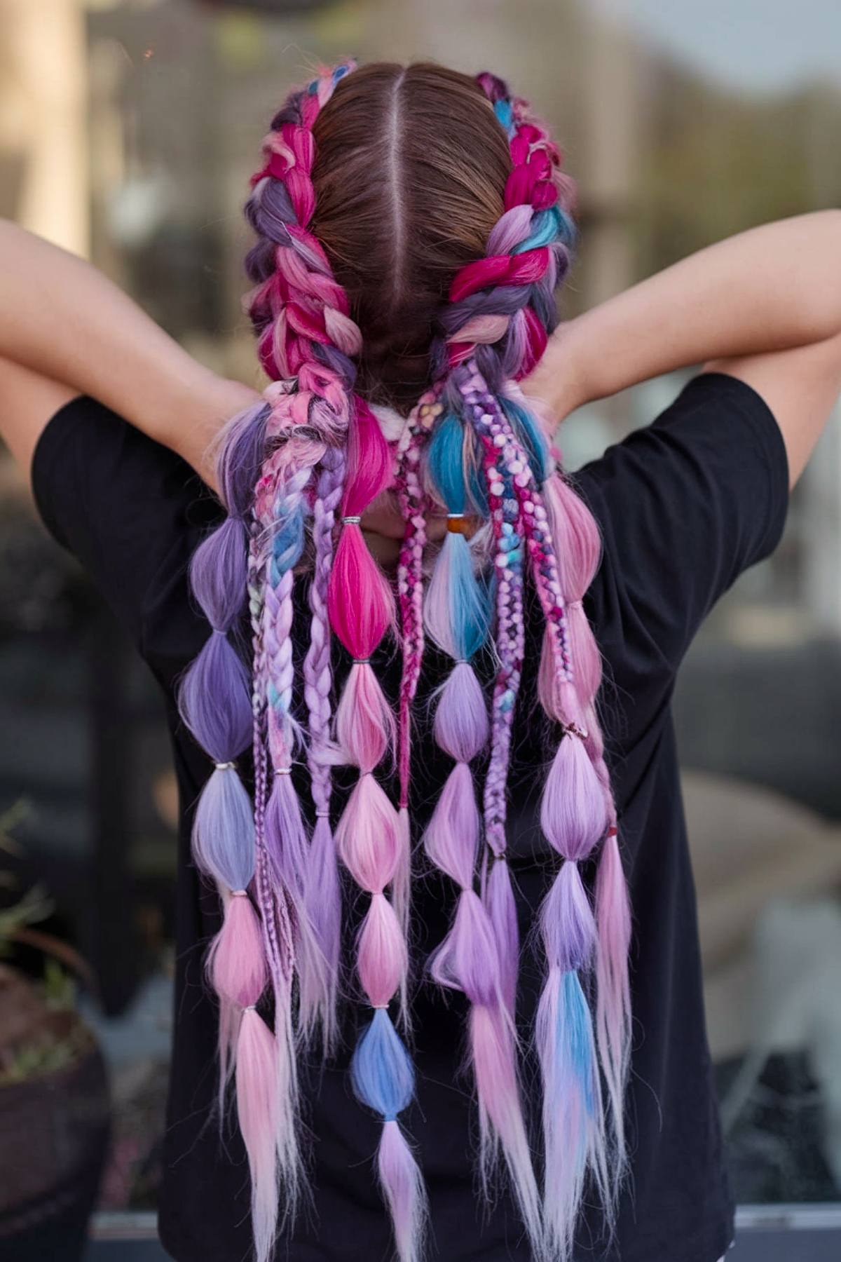 Multicolored braids with bubbles for music festival hair