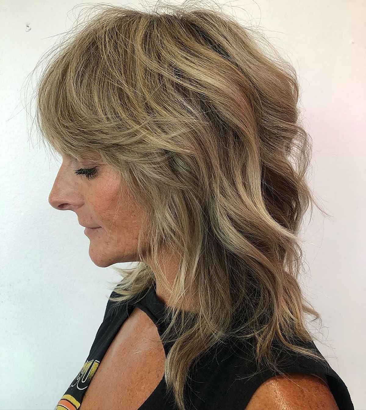 Razored Cut for a 60-Year-Old Woman with Mid-Length Hair