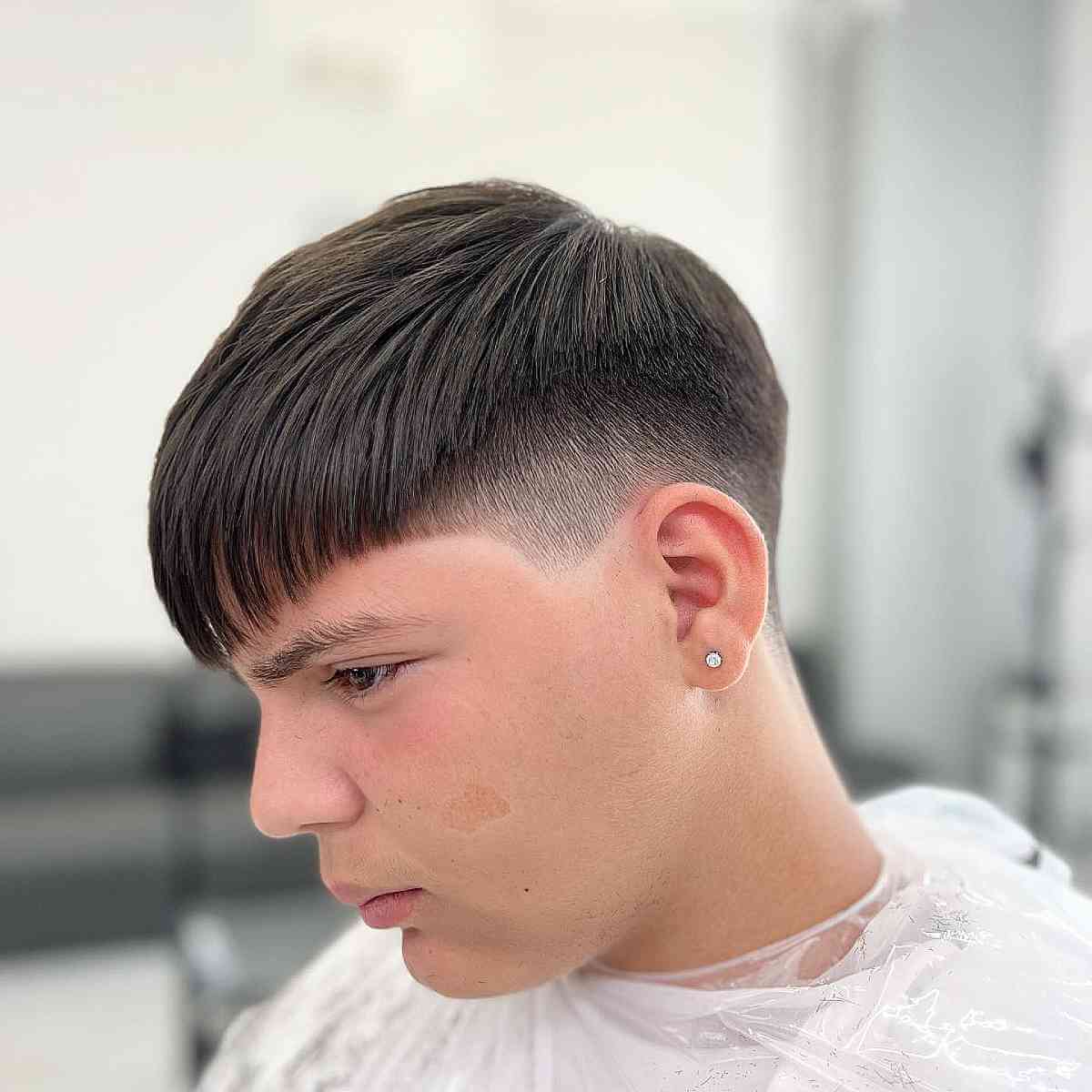 Razored Mid Fade with Bangs for Teen Boys