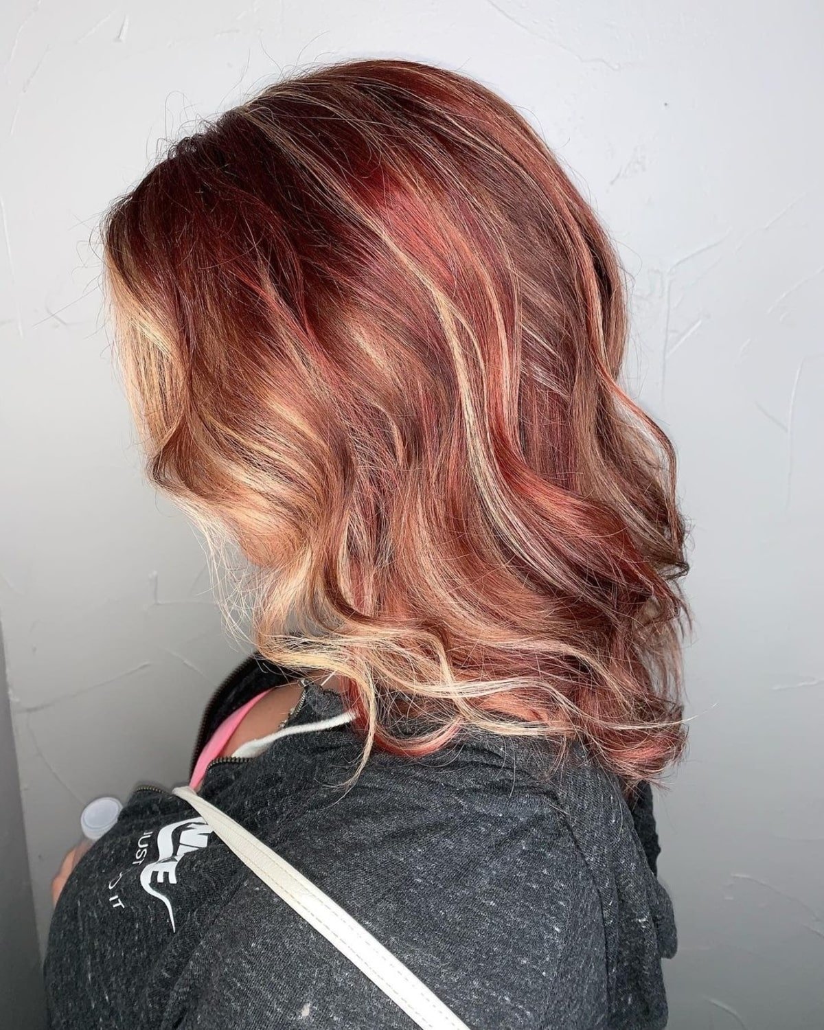 Red-blonde hair with highlights