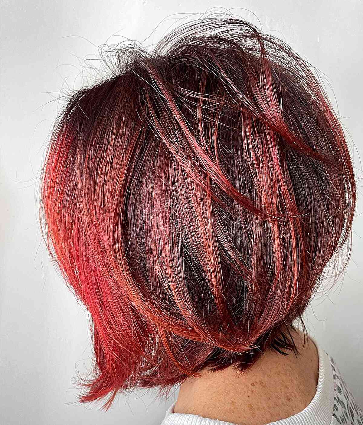 Neck-Length Red Blowout Stacked Long Bob with Tousled Layers