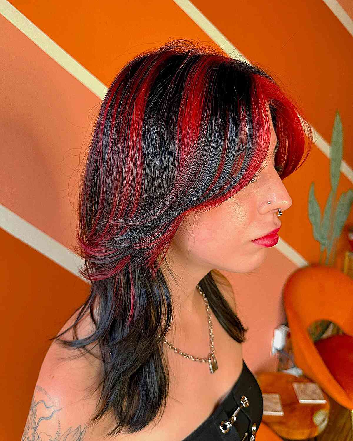 Red Chunky Highlights and Medium Feathery Layers for Black Hair