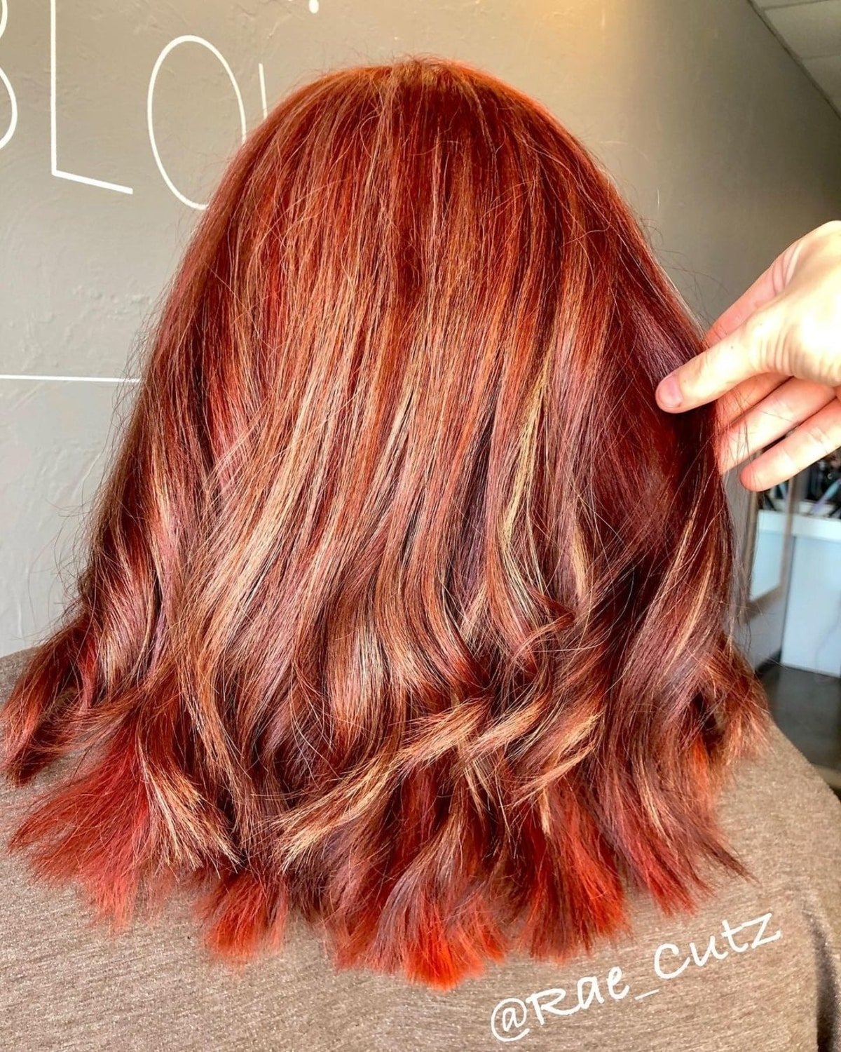 Bold Red hair with red lowlights