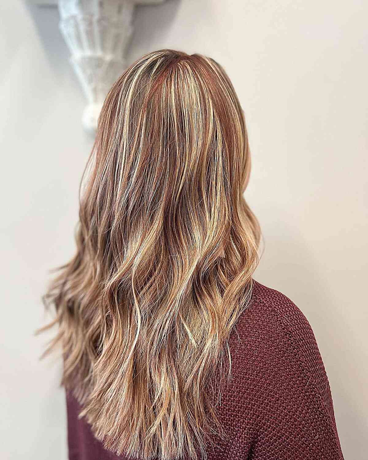 Red highlights on dirty blonde hair