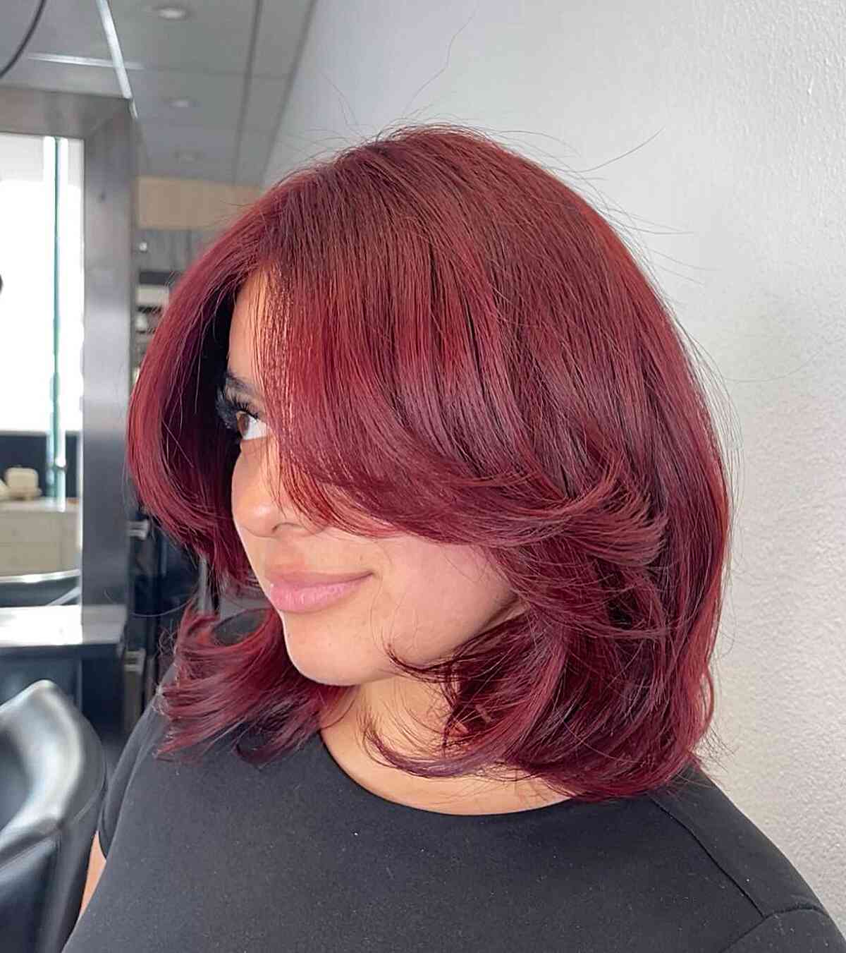 Red Long Bouncy Bob with Feathery Layers and Face-Framing Bangs