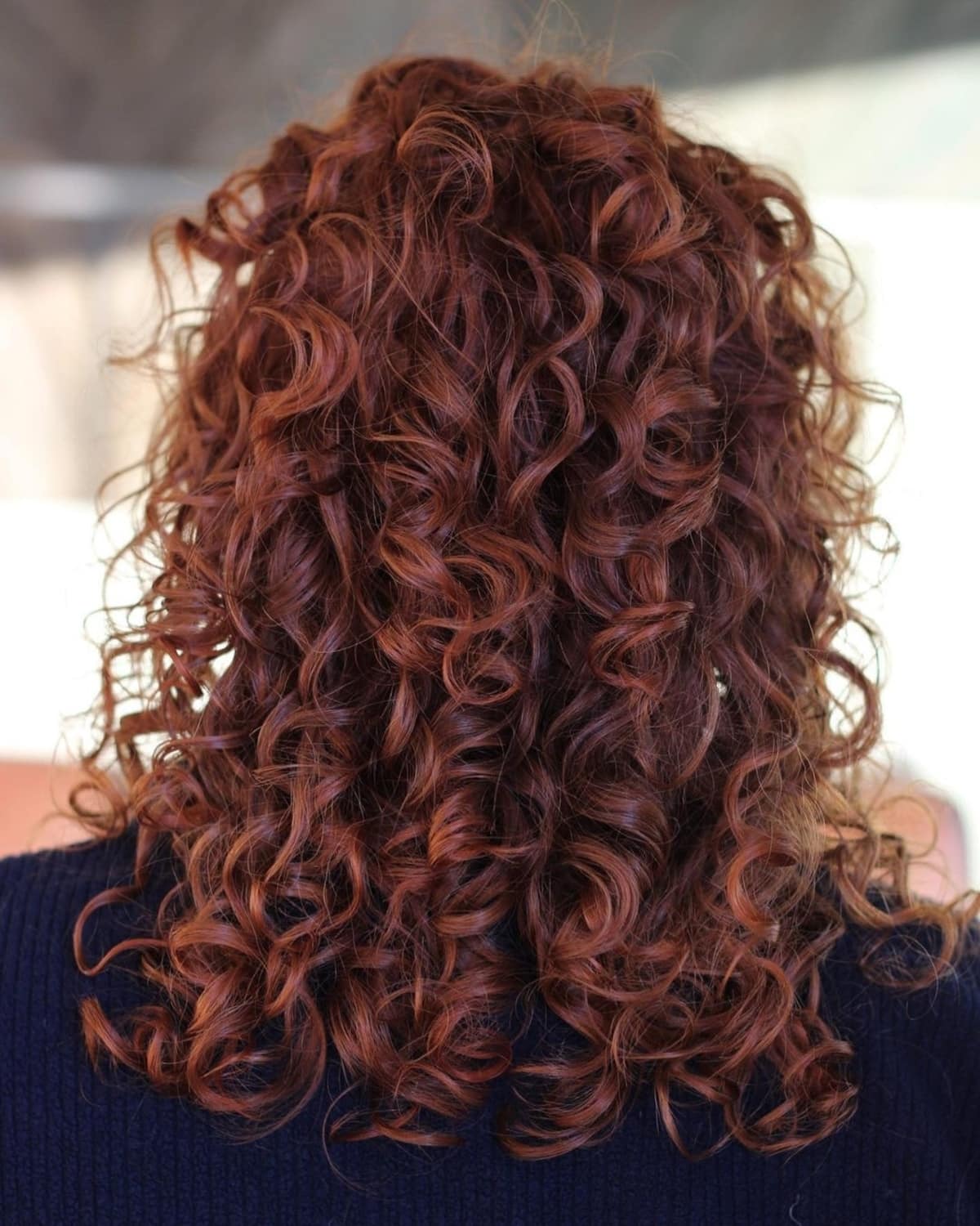 Bold Red medium-to-long curly hair