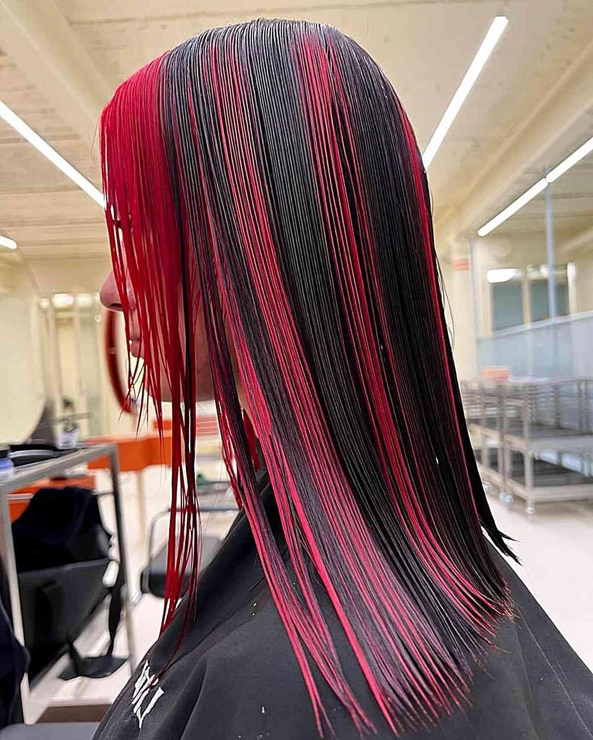 Red Skunk Stripes on Shoulder-Length Jet Black Hair