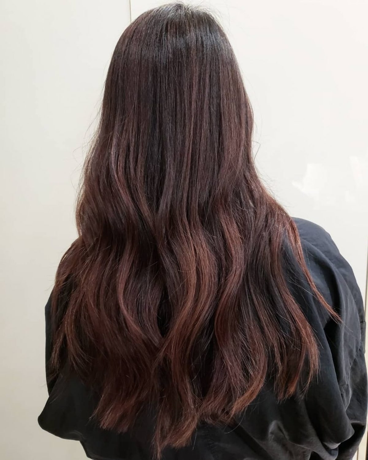Unique reddish brown highlights on black hair