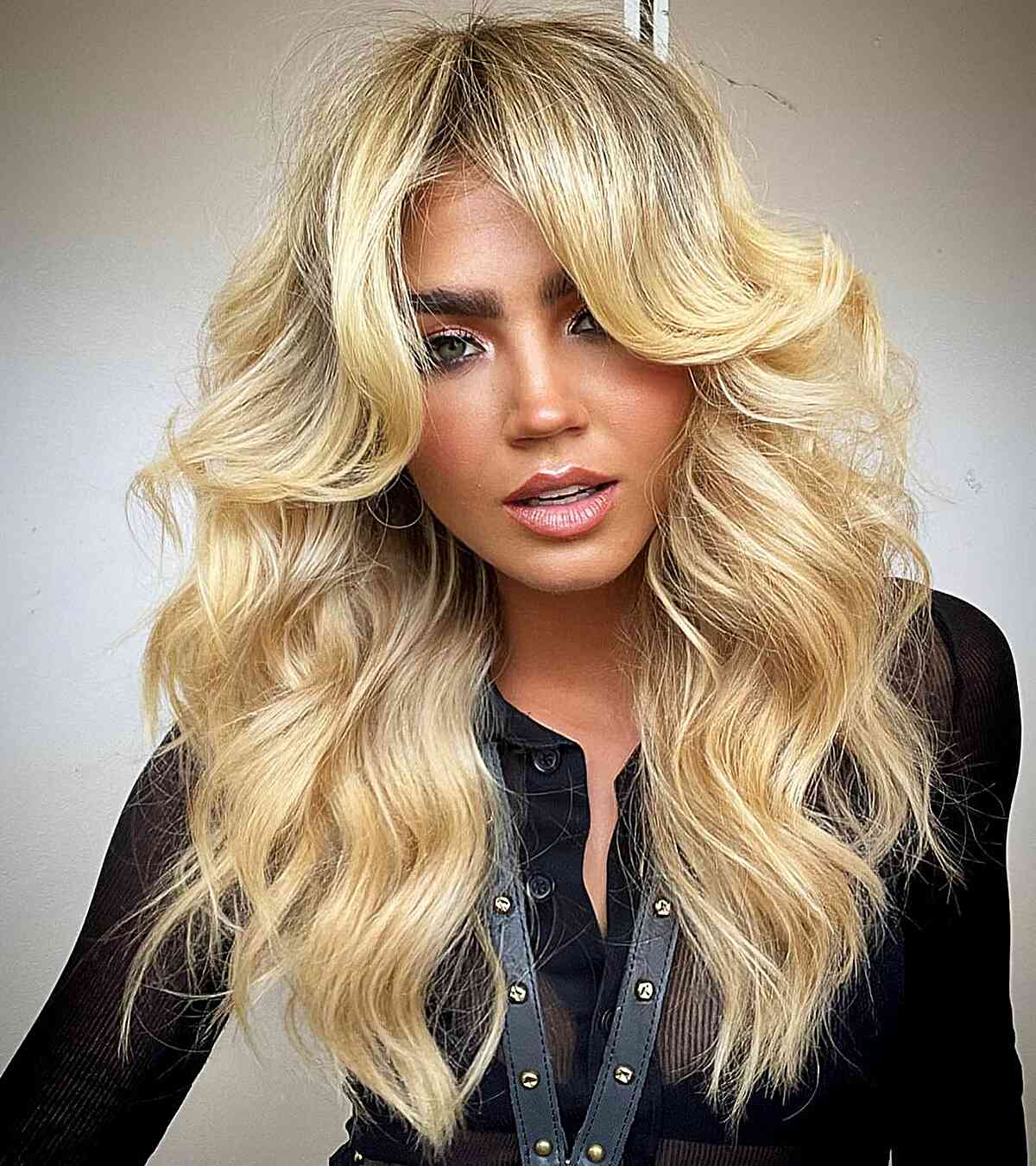 Reflective Blonde Tones with Face-Framing Layers for Long Hair with waves