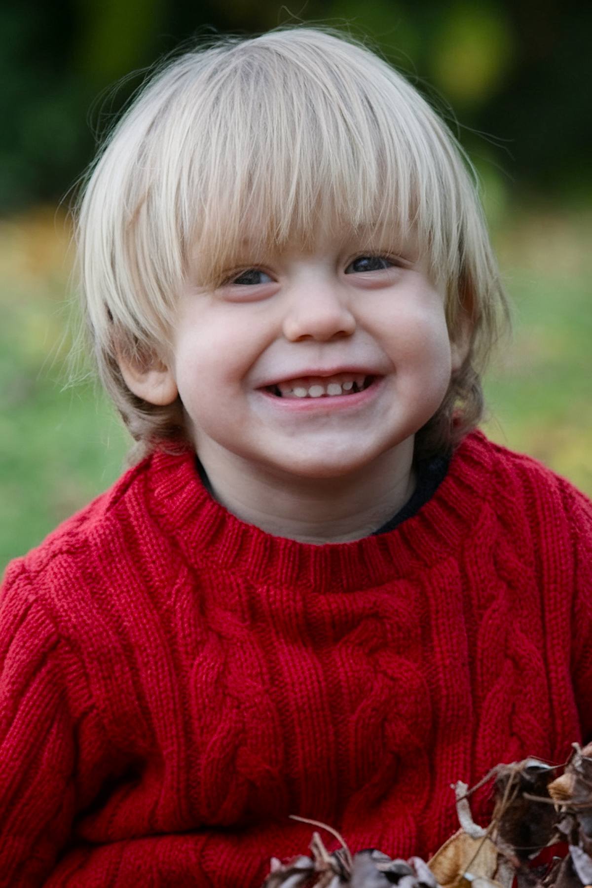 80s-inspired toddler boy haircut with layered shaggy style