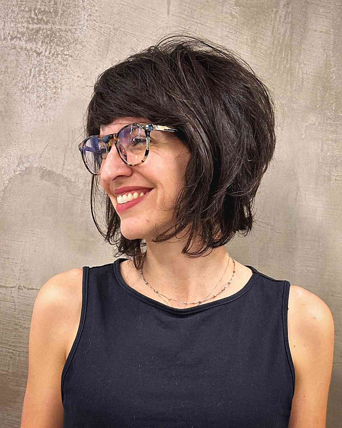 Retro-Inspired Shag with Sweeping Fringe for women with glasses and long faces