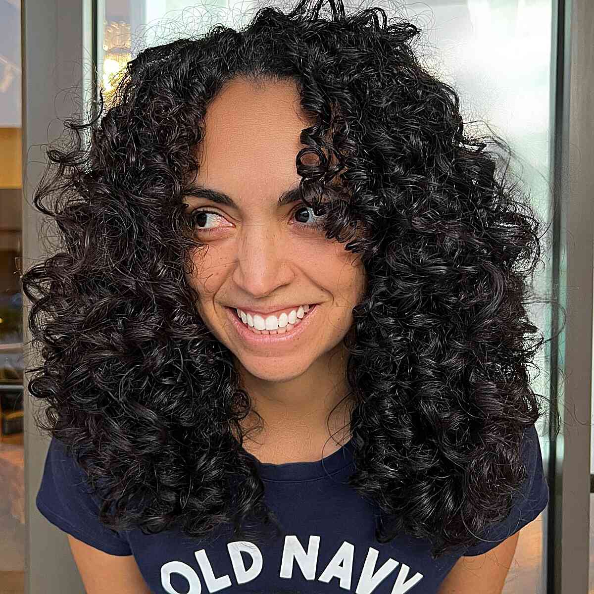 Rezo Curly Cut with a Face Frame on a Shoulder-Length Cut for Thick-Haired Ladies