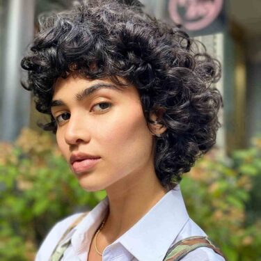 33 Best Short Curly Hair with Bangs to Try This Year