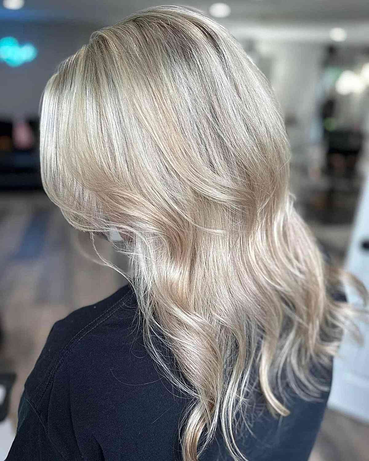 Rich White Champagne Blonde with Root Smudge on Mid-Length Haircut