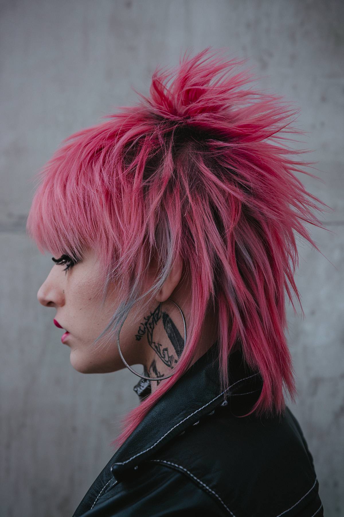 Edgy Rockullet haircut with sharp layers and bold, spiky texture for a rebellious style