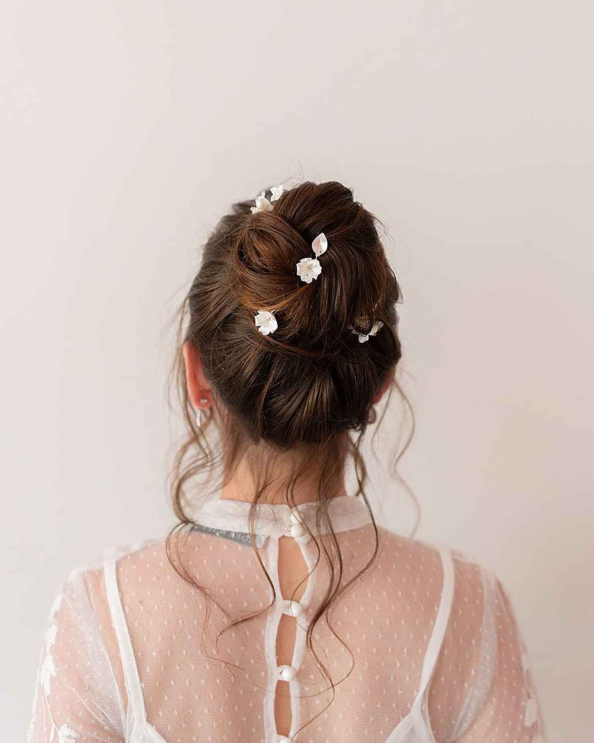 Romantic Bun Updo with Floral Hairpins