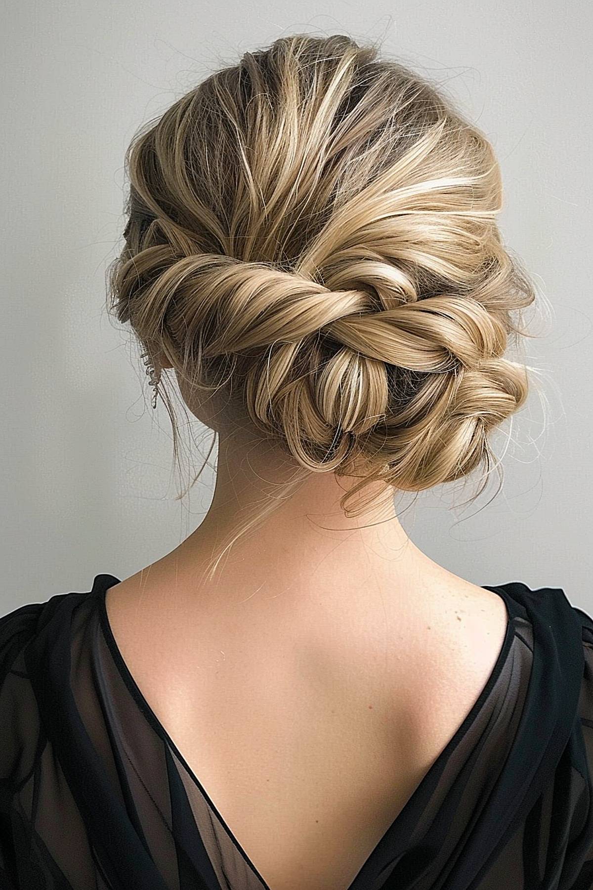 Romantic side updo for bridesmaid hair with soft twists