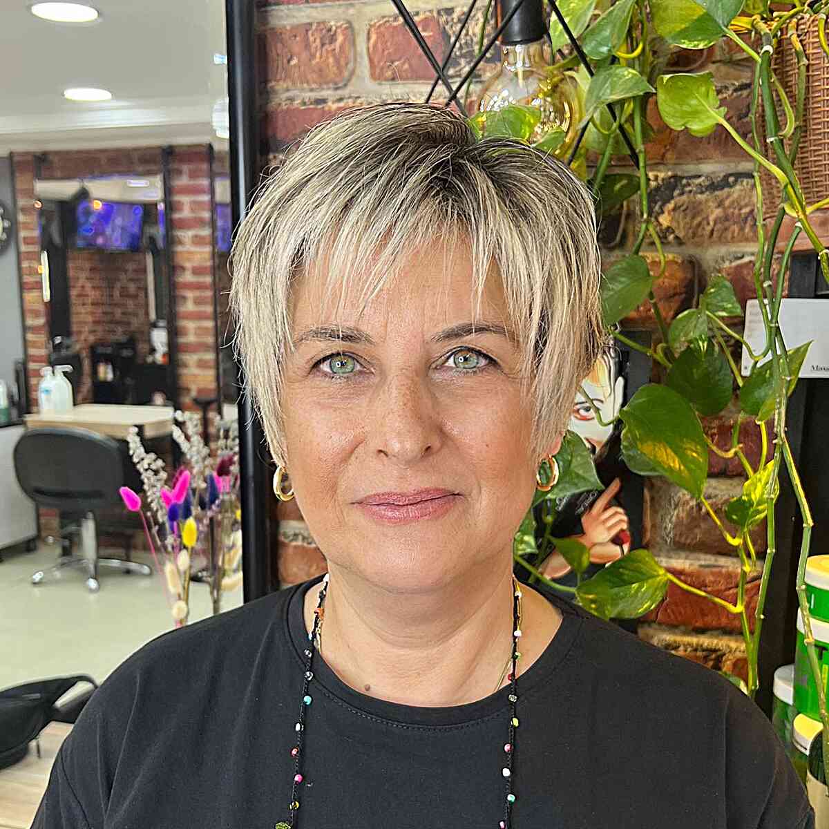Rooted Blonde Long Choppy Pixie with Thin Bangs on Mature Ladies