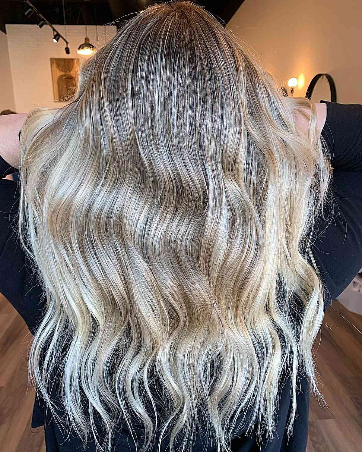 Rooted Platinum Dirty Blonde Balayage on Long Hair with Choppy Ends