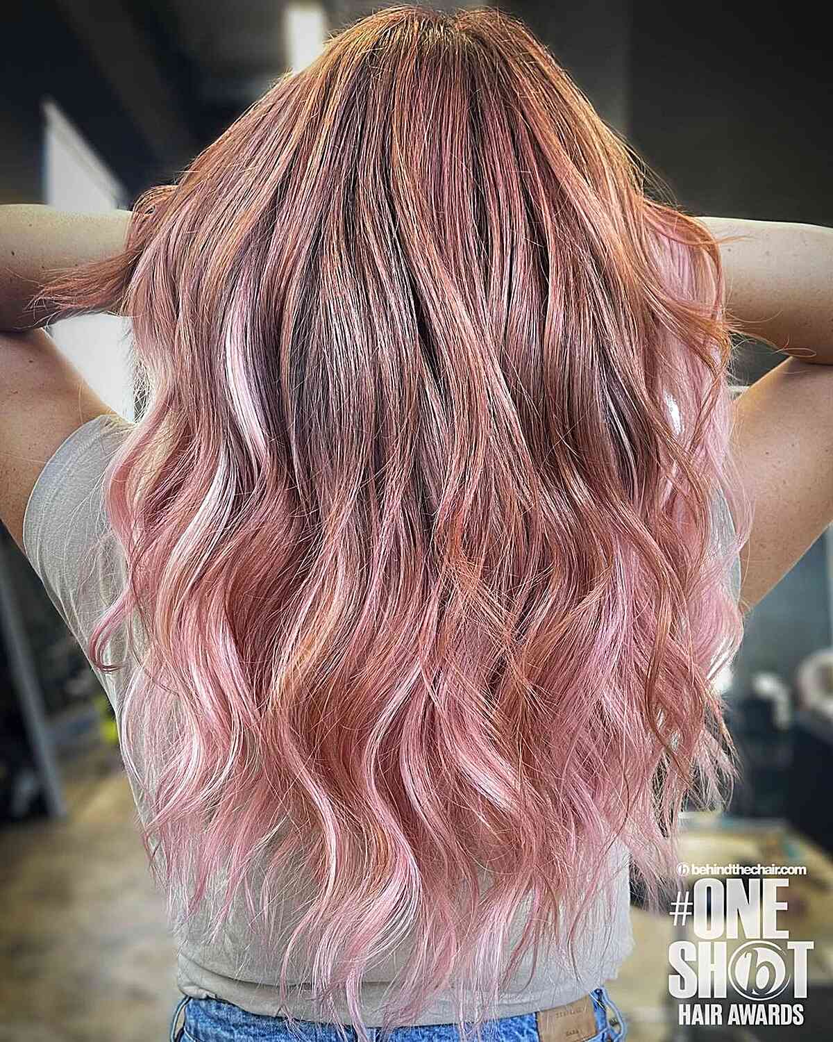 Rose gold hair with a Pink Lemonade hue on long hair with a brown base