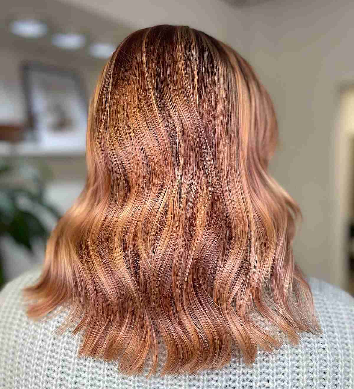 Rose Gold Strawberry Blonde Balayage with Dark Roots
