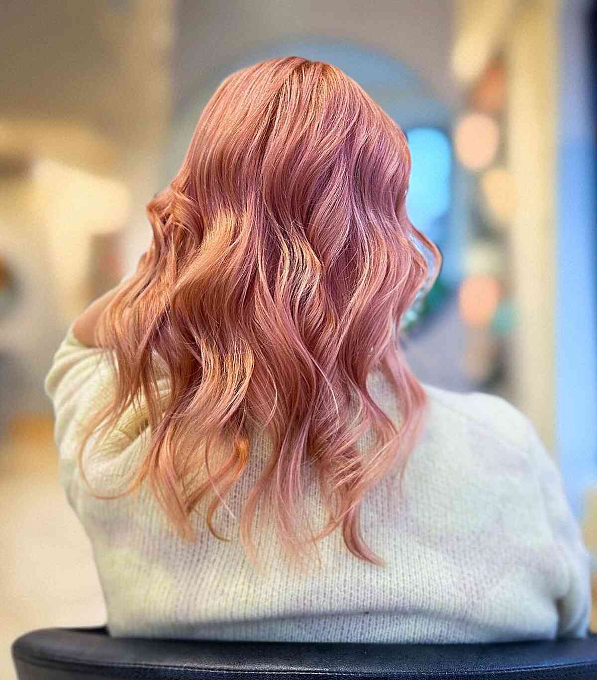 Rosy Gold Strawberry Blonde Hair on Mid-Length Cut with Waves