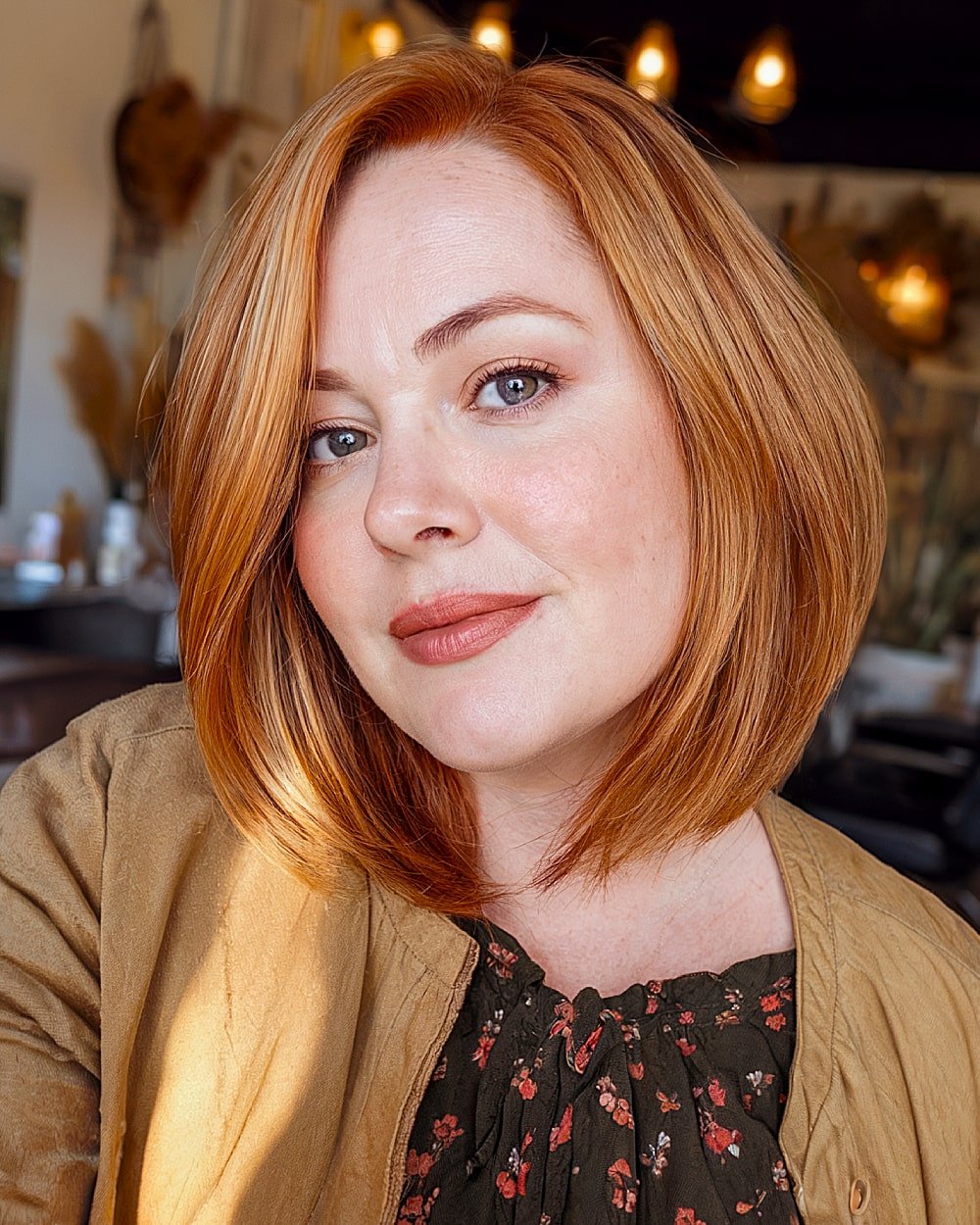 Rounded ginger lob with smooth, face-hugging layers for over 40 women with round faces