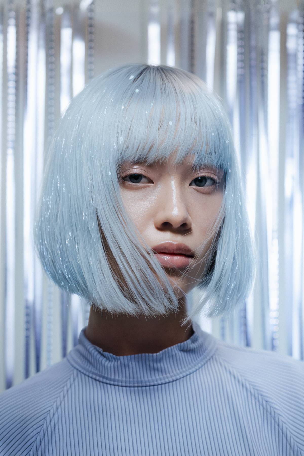 Selenite sleek bob with pure white-silver hair and a polished, high-gloss shine