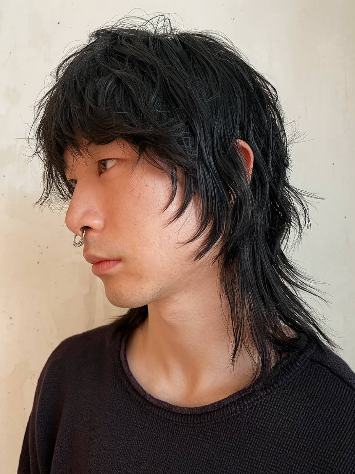 Black shaggy mullet hairstyle for men