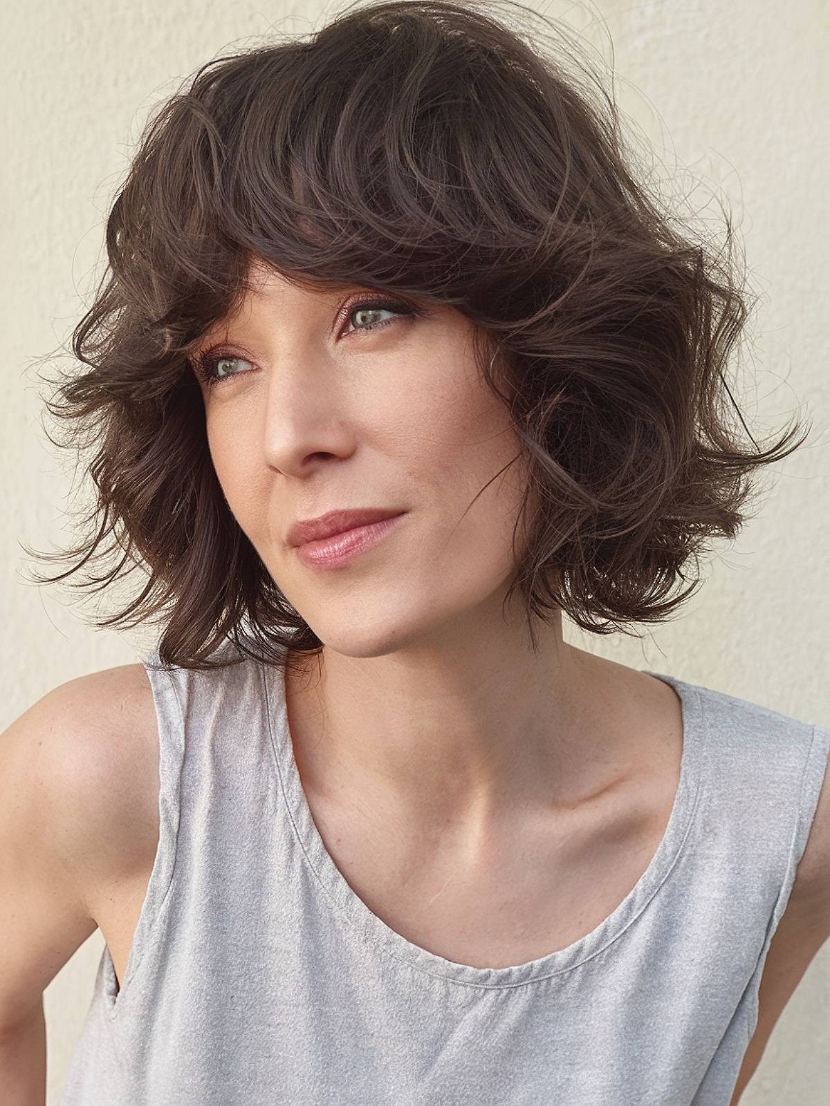 Shaggy bob hair with soft layers and face-framing bangs