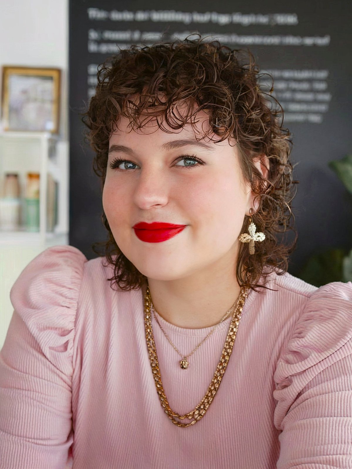 Shaggy curly mullet haircut with tousled layers