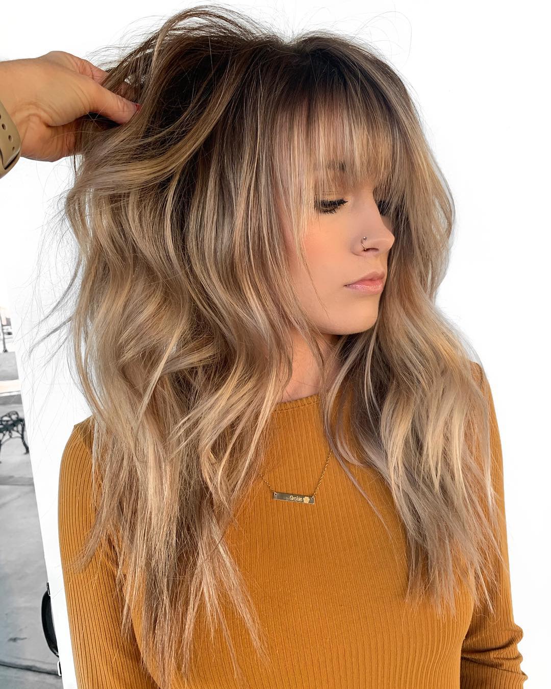 Feathery Textured Shag with Bangs on Bronde Balayage Hair