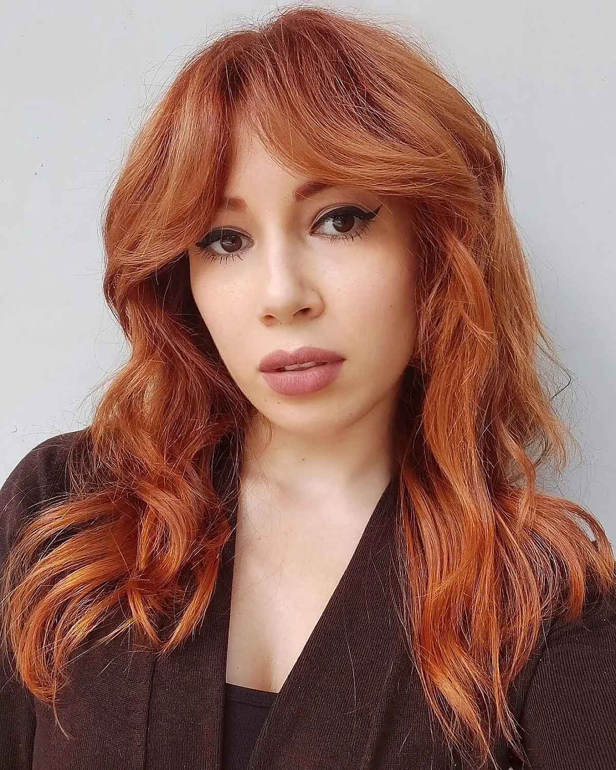 Shaggy Layers and Curtain Bangs for Ginger Hair