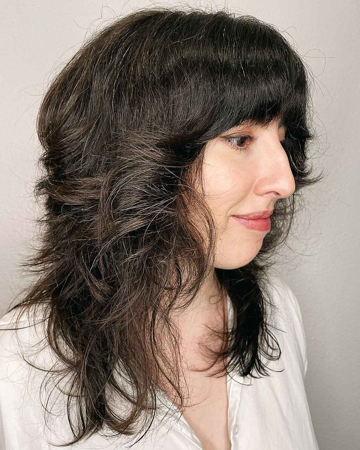 Shaggy Wolf Cut with Heavy Bangs for Thick Hair