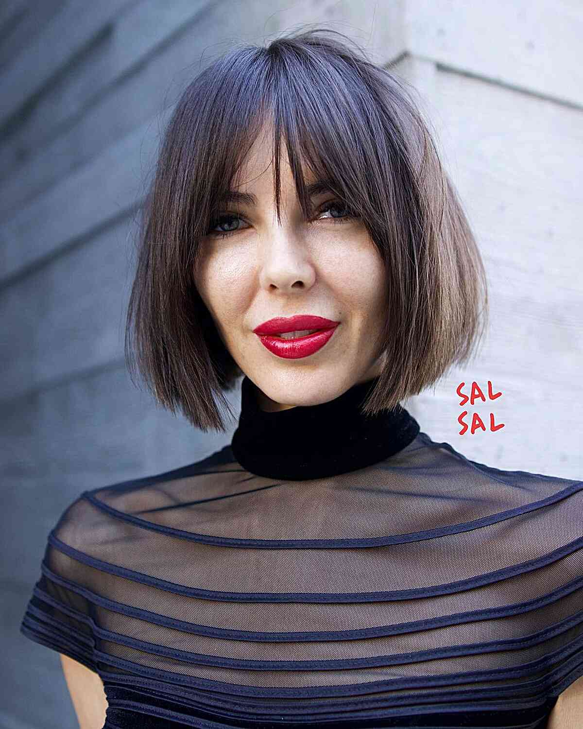 Sharp Chin-Length Cut with Wispy Bangs for women with long faces and large foreheads