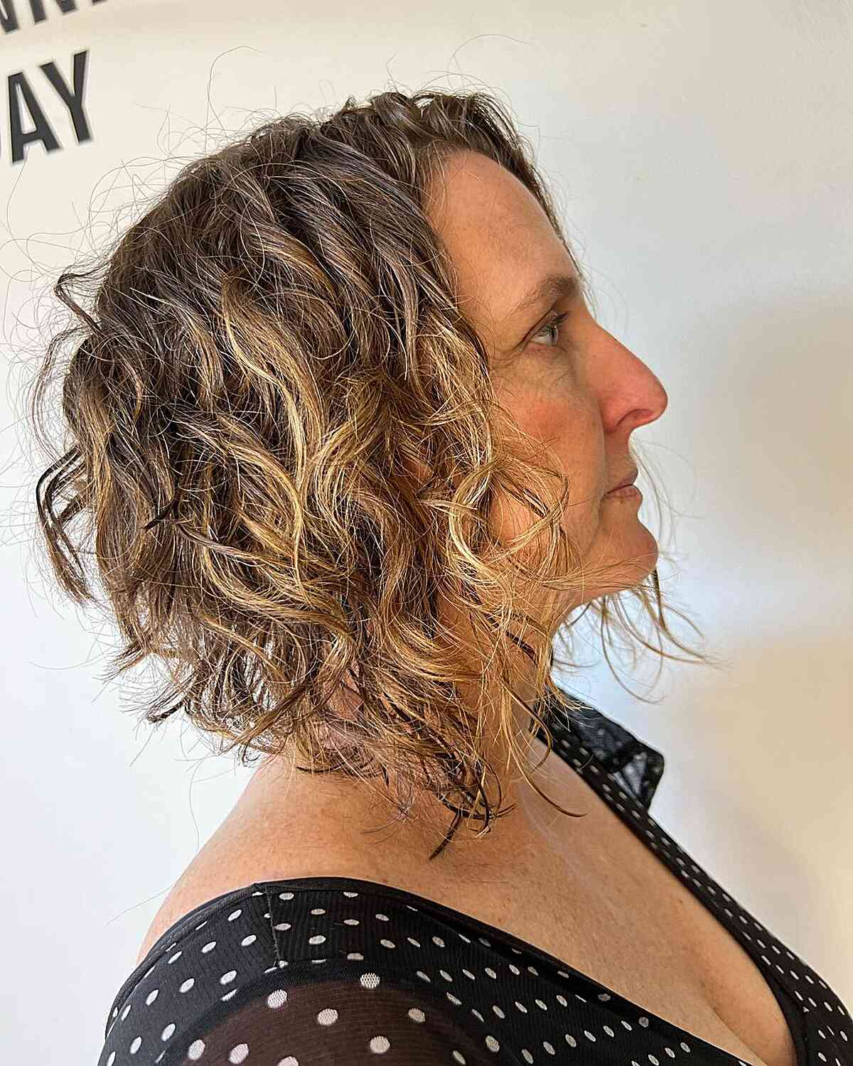 Short A-Line Cut with Curly and Choppy Layers for Mature Women Aged 60