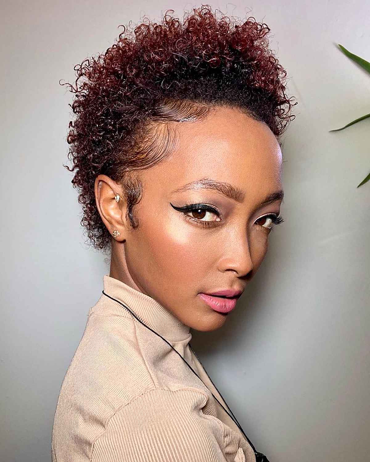 short and natural undercut with longer hair on top