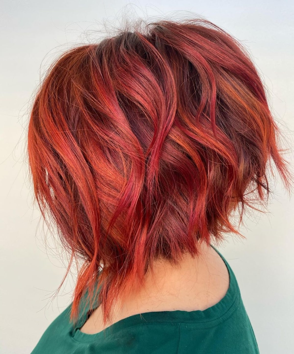 short and red angled asymmetrical bob