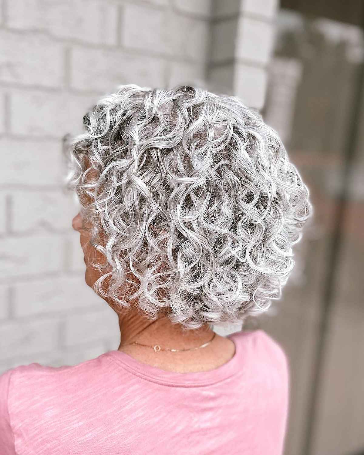 Short and Silver Haircut for Curly Hair for women past 70