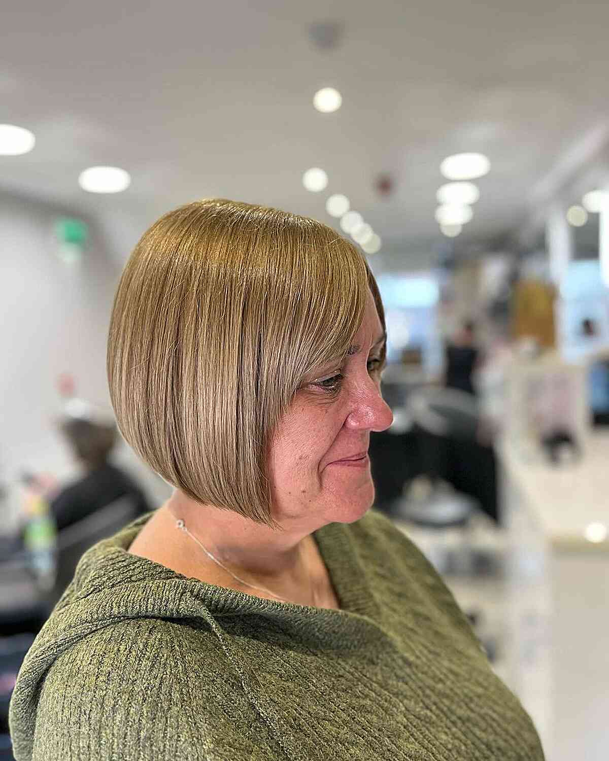 Short and Sleek Inverted Bob Cut on 50-year-old Ladies