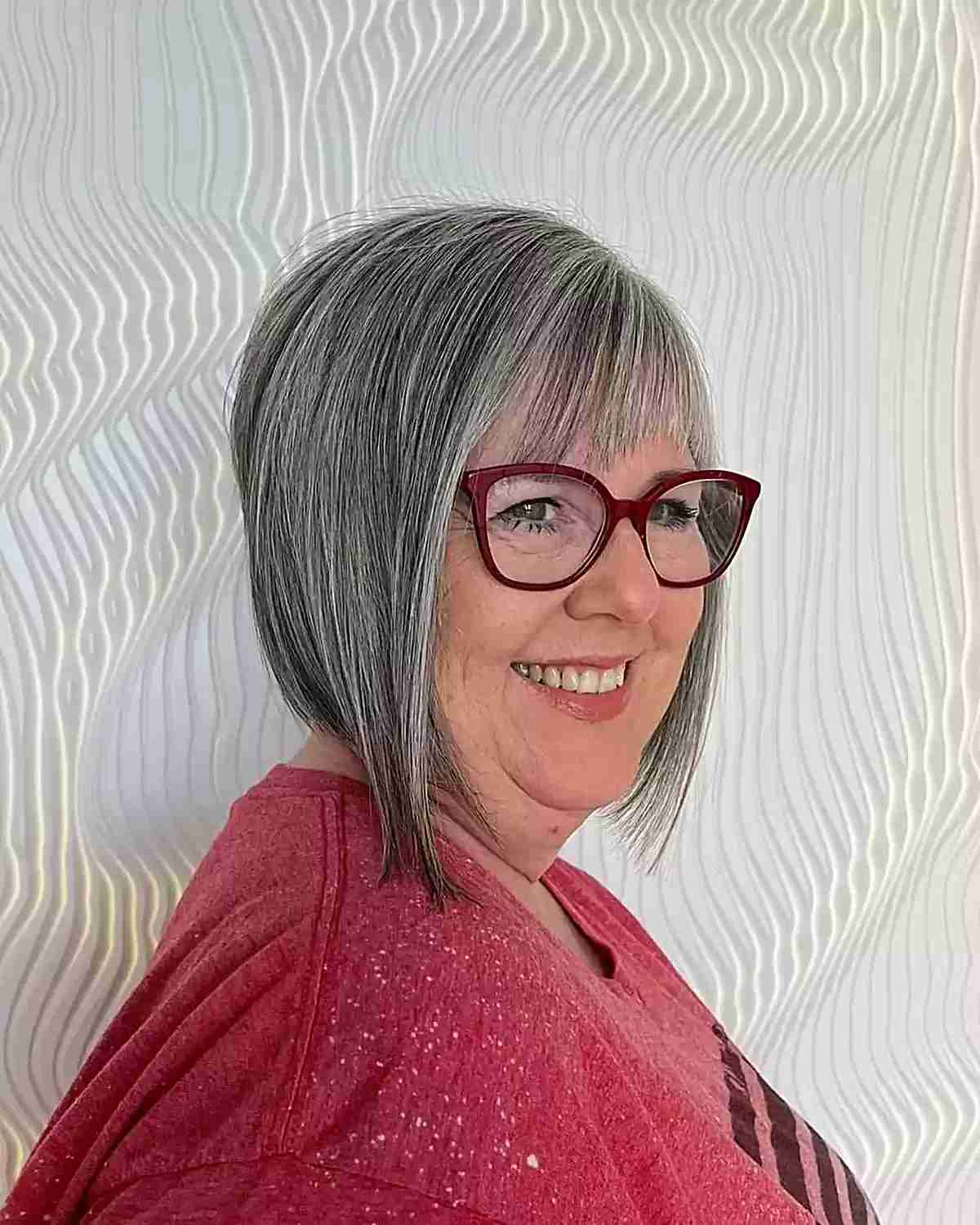 Short Angled Grey Bob with Asymmetrical Bangs for 60-Year-Old Ladies