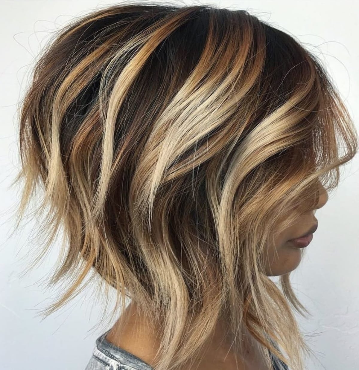 Short angled haircut with wavy stacked layers