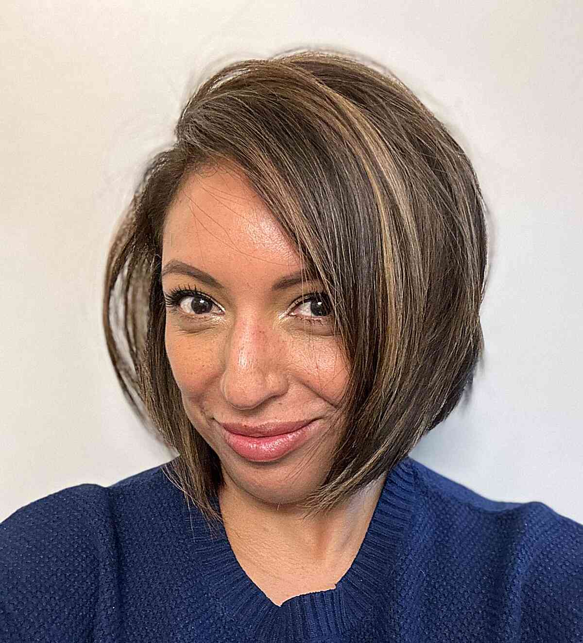 Short Bob with Highlights with a Deep Side Part for larger foreheads