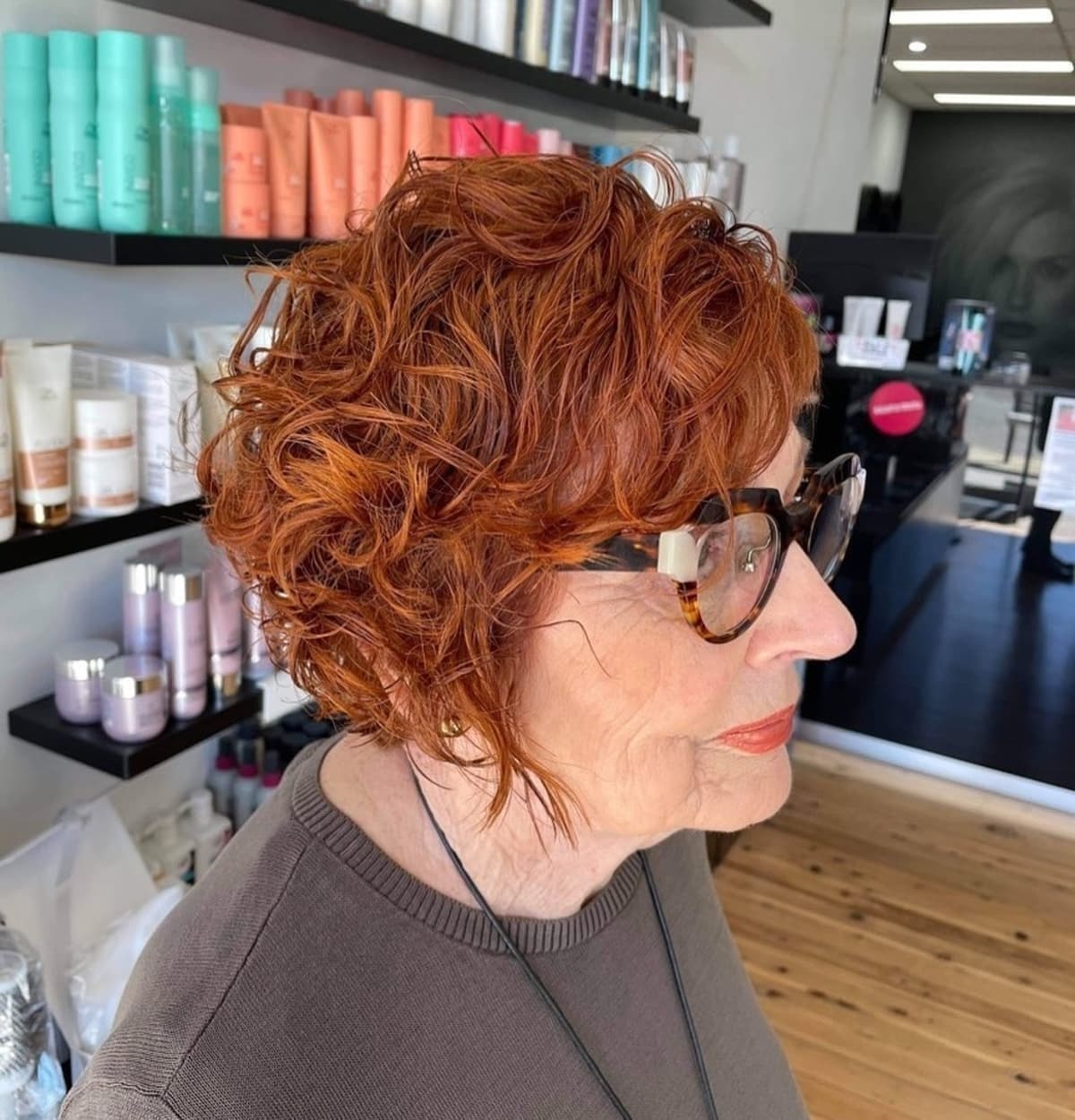 Short asymmetrical Bob for women over 60 with curly hair